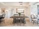 Elegant dining area with a rustic wood table and crystal chandelier at 7117 E Rancho Vista Dr # 4011, Scottsdale, AZ 85251