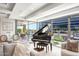 Elegant living room with floor to ceiling windows and a grand piano at 7117 E Rancho Vista Dr # 4011, Scottsdale, AZ 85251