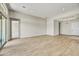 Spacious living room with tile flooring and access to patio at 19003 W Lawrence Rd, Waddell, AZ 85355
