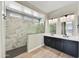 Elegant bathroom with double vanity and marble shower at 19003 W Lawrence Rd, Waddell, AZ 85355