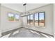 Bright dining area with large windows and chandelier at 19003 W Lawrence Rd, Waddell, AZ 85355