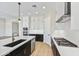 Modern kitchen with stainless steel appliances and island at 19003 W Lawrence Rd, Waddell, AZ 85355