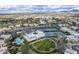 Community overview featuring tennis courts, pool, and green spaces at 7700 E Gainey Ranch Rd # 103, Scottsdale, AZ 85258