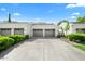Two-car garage and well manicured landscaping at 7700 E Gainey Ranch Rd # 103, Scottsdale, AZ 85258