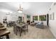Bright living room with dining area and fireplace at 7700 E Gainey Ranch Rd # 103, Scottsdale, AZ 85258