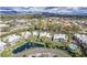 Aerial view of community with pool and pond at 7700 E Gainey Ranch Rd # 103, Scottsdale, AZ 85258