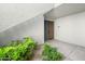 Private entrance with landscaping and gray door at 7700 E Gainey Ranch Rd # 103, Scottsdale, AZ 85258