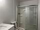 Clean bathroom with a tub shower combo and white vanity at 4950 N Miller Rd # 220, Scottsdale, AZ 85251