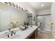 Double vanity bathroom with a shower at 886 W St Andrews Dr, Casa Grande, AZ 85122