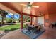 Covered patio with seating area, ceiling fans, and backyard view at 886 W St Andrews Dr, Casa Grande, AZ 85122