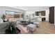 Open living room with access to backyard and neutral color palette at 37535 W Padilla St, Maricopa, AZ 85138