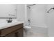 Clean bathroom with a tub, shower, and modern vanity at 37535 W Padilla St, Maricopa, AZ 85138