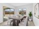 Bright dining room with sliding glass doors leading to the backyard at 37535 W Padilla St, Maricopa, AZ 85138