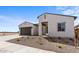 Two-car garage home with desert landscaping and a neutral color palette at 37535 W Padilla St, Maricopa, AZ 85138