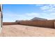 Empty lot with block wall and dirt. Plenty of space for landscaping and building at 37535 W Padilla St, Maricopa, AZ 85138