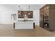 Spacious kitchen with an island, dark brown cabinets, and modern appliances at 37535 W Padilla St, Maricopa, AZ 85138