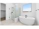 Modern bathroom with a soaking tub and walk-in shower at 37535 W Padilla St, Maricopa, AZ 85138