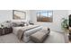 Main bedroom with a king bed and stylish decor at 37535 W Padilla St, Maricopa, AZ 85138