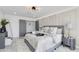 Main bedroom with gray platform bed, elegant decor, and double doors at 5917 E North Ln, Paradise Valley, AZ 85253