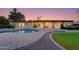 Stunning backyard oasis with a pool, patio, and landscape lighting at 5917 E North Ln, Paradise Valley, AZ 85253