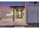 Modern home exterior with stone accents and a covered entryway at 5917 E North Ln, Paradise Valley, AZ 85253