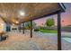 Evening view of covered patio, pool, and backyard at 5917 E North Ln, Paradise Valley, AZ 85253