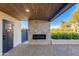 Covered patio with fireplace and access to pool at 5917 E North Ln, Paradise Valley, AZ 85253
