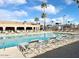 Inviting community pool with lounge chairs and surrounding patio at 241 S Aquamarine Dr, Apache Junction, AZ 85119