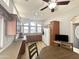 Kitchen features a breakfast bar, lots of cabinets and a view into the living room at 241 S Aquamarine Dr, Apache Junction, AZ 85119