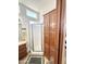 Bathroom includes a shower, wood cabinets, and linen storage at 241 S Aquamarine Dr, Apache Junction, AZ 85119