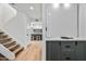 Light-filled hallway with view of kitchen and staircase at 8055 E Thomas Rd # E117, Scottsdale, AZ 85251