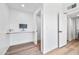 Clean hallway with light walls and wood floors at 8055 E Thomas Rd # E117, Scottsdale, AZ 85251
