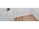 Bright hallway with wood floors and modern door handles at 8055 E Thomas Rd # E117, Scottsdale, AZ 85251