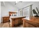 Spacious bedroom with wood furniture and large windows at 8055 E Thomas Rd # E117, Scottsdale, AZ 85251