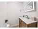 Stylish powder room with wood vanity and modern fixtures at 8055 E Thomas Rd # E117, Scottsdale, AZ 85251
