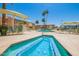 Community spa with surrounding patio furniture and palm trees at 8055 E Thomas Rd # E117, Scottsdale, AZ 85251