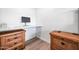 Home office with wood desk and built-in workspace at 8055 E Thomas Rd # E117, Scottsdale, AZ 85251