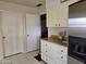 Kitchen with light cabinets, wood countertops, and appliances at 11021 W Welk Dr, Sun City, AZ 85373