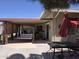 Covered patio with seating area and swing perfect for outdoor relaxation at 11021 W Welk Dr, Sun City, AZ 85373