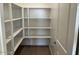 Bright and spacious corner pantry with ample shelving at 7689 W Tether Trl, Peoria, AZ 85383