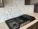 Gas cooktop with griddle, built into kitchen counter at 7689 W Tether Trl, Peoria, AZ 85383