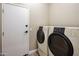 Bright laundry room features washer and dryer, and extra storage at 19550 N Grayhawk Dr # 1084, Scottsdale, AZ 85255