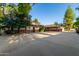 House exterior with a basketball court and large yard at 1020 E Caroline Ln, Tempe, AZ 85284
