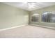 Spacious bedroom with large windows and ceiling fan at 1020 E Caroline Ln, Tempe, AZ 85284