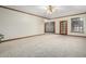 Bright bedroom with carpeted floors and access to backyard at 1020 E Caroline Ln, Tempe, AZ 85284