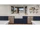 Kitchen with farmhouse sink, blue cabinetry, and stainless steel appliances at 1020 E Caroline Ln, Tempe, AZ 85284