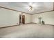 Spacious bedroom with carpeted floors and ceiling fan at 1020 E Caroline Ln, Tempe, AZ 85284