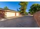 Motor court with attached three-car garage at 1020 E Caroline Ln, Tempe, AZ 85284