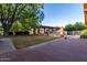 Landscaped backyard with large trees and pool at 1020 E Caroline Ln, Tempe, AZ 85284