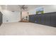 Spacious living area with dark gray walls and carpeting at 1020 E Caroline Ln, Tempe, AZ 85284